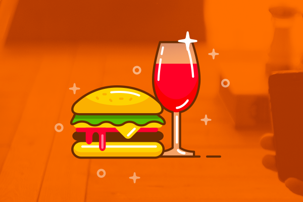 Burger and wine icon on orange background, representing digital creativity at a Dublin design and marketing agency.